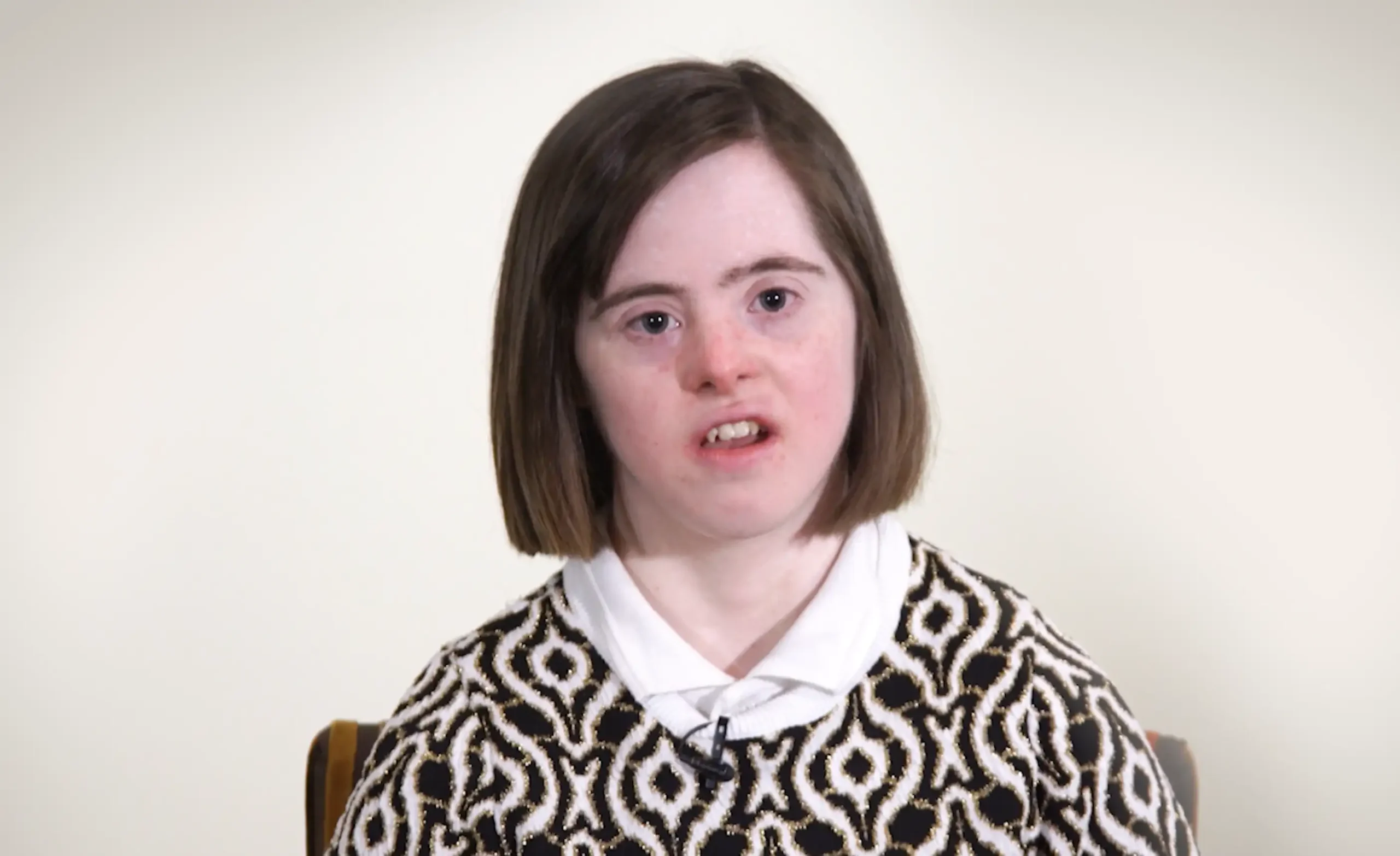 Young girl speaking to camera about advocacy